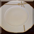 K46. Set of Richard Ginori chargers including 12 white with gold rim chargers, 2 white with gold ribbon charger, 4 gold chargers, 3 Griffe smokey and gold trim chargers - $240 